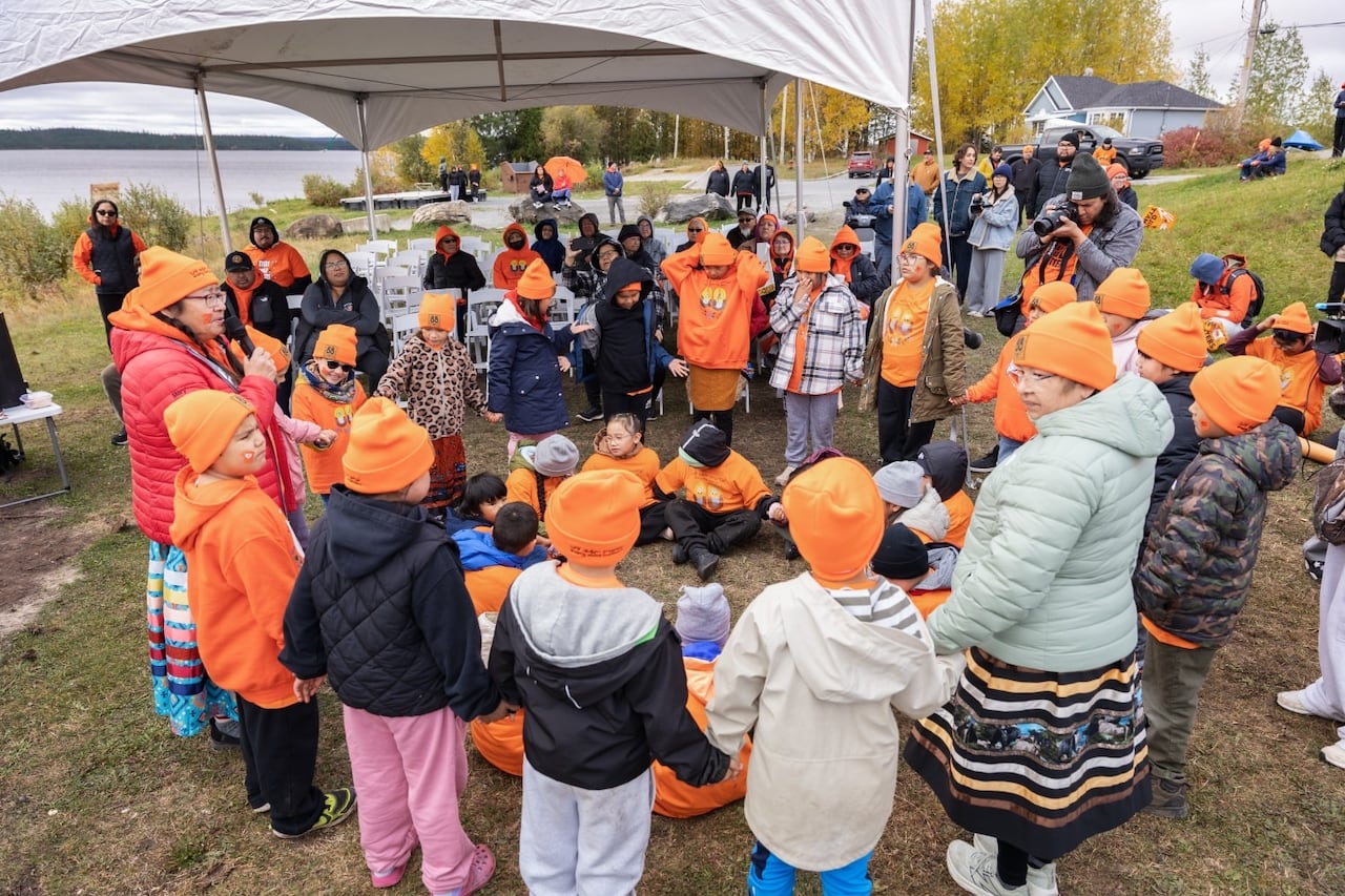 Voyageur Memorial Elementary School students holding hands.